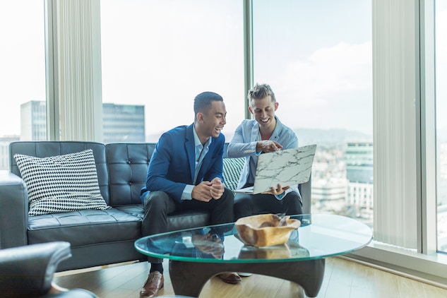 business men looking at computer