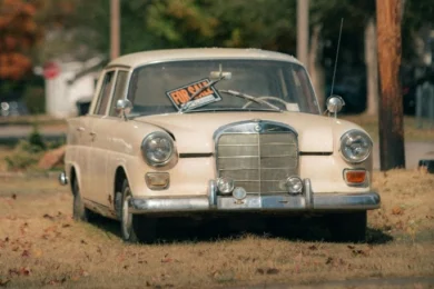 Car with a for sale sign in the window