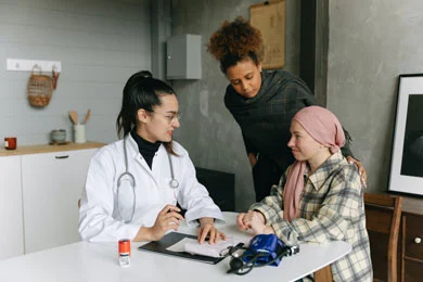 A principal and agent talk to doctor about living will and medical power of attorney provisions.