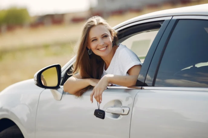 Woman with a used car