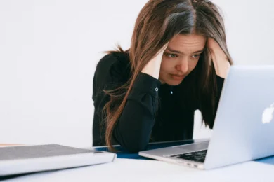 stressed out woman in front of a computer