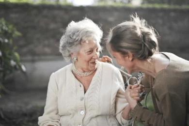 younger woman caring for an elderly woman